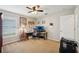 Functional bedroom or office space with carpet, fan, and ample desk area for working at home at 4511 Swift Cir, Valrico, FL 33596