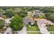 Well-maintained home with lush green lawn, mature trees, and a long driveway in a peaceful neighborhood at 4511 Swift Cir, Valrico, FL 33596