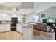 Open kitchen with granite countertops and seamless flow to living area, great for entertaining at 4511 Swift Cir, Valrico, FL 33596