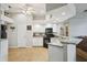 Spacious kitchen featuring granite countertops, white cabinets, and an open layout at 4511 Swift Cir, Valrico, FL 33596