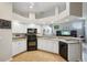Functional kitchen with granite countertops, open to the living space, and abundant natural light at 4511 Swift Cir, Valrico, FL 33596