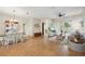 Open-concept living room featuring tile floors, neutral colors, and access to the outdoor patio at 4511 Swift Cir, Valrico, FL 33596