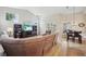 Bright and airy living room with a large sectional sofa, vaulted ceilings, and sliding glass doors at 4511 Swift Cir, Valrico, FL 33596