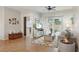 Cozy living room with tile flooring, neutral decor, and sliding glass doors to the patio at 4511 Swift Cir, Valrico, FL 33596