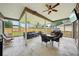Spacious screened-in patio with comfortable seating, perfect for enjoying the outdoors year-round at 4511 Swift Cir, Valrico, FL 33596