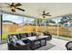 Large screened-in patio with comfortable seating and views of the backyard at 4511 Swift Cir, Valrico, FL 33596