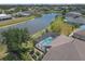 Beautiful aerial view of the home featuring a screened pool and peaceful waterfront setting at 4535 29Th Avenue E Cir, Palmetto, FL 34221