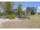 Beautiful backyard featuring mature trees, a screened lanai, and serene landscaping at 4535 29Th Avenue E Cir, Palmetto, FL 34221