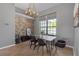 Inviting dining room featuring a brick accent wall and modern chandelier at 4535 29Th Avenue E Cir, Palmetto, FL 34221