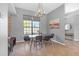 Cozy dining area with modern light fixture and a large window at 4535 29Th Avenue E Cir, Palmetto, FL 34221