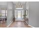 Welcoming entryway with a modern chandelier and decorative glass front door at 4535 29Th Avenue E Cir, Palmetto, FL 34221