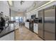 Modern kitchen with white cabinets and stainless steel refrigerator at 4535 29Th Avenue E Cir, Palmetto, FL 34221