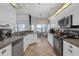 Spacious kitchen with white cabinets, stainless steel appliances, and tile flooring at 4535 29Th Avenue E Cir, Palmetto, FL 34221