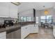 Bright kitchen featuring white cabinets and modern stainless steel appliances at 4535 29Th Avenue E Cir, Palmetto, FL 34221