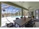 Outdoor dining area with lake views, ceiling fan and access to the backyard swimming pool at 4535 29Th Avenue E Cir, Palmetto, FL 34221