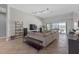 Open-concept living room with neutral decor, tile flooring, and views of the screened-in lanai at 4535 29Th Avenue E Cir, Palmetto, FL 34221