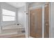 Elegant main bathroom with a soaking tub and walk-in shower at 4535 29Th Avenue E Cir, Palmetto, FL 34221