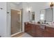 Stylish main bathroom with a double sink vanity and a glass-enclosed shower at 4535 29Th Avenue E Cir, Palmetto, FL 34221