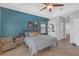 Spacious main bedroom with a tray ceiling, a sitting area and neutral decor at 4535 29Th Avenue E Cir, Palmetto, FL 34221