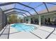 Backyard pool with a screen enclosure and a covered patio for lounging and entertaining at 4535 29Th Avenue E Cir, Palmetto, FL 34221