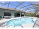Screened-in pool area featuring a clean pool, spacious lanai and lush landscaping at 4535 29Th Avenue E Cir, Palmetto, FL 34221