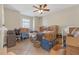 A room full of moving boxes, chairs and a desk awaiting to be organized at 4535 29Th Avenue E Cir, Palmetto, FL 34221