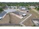 House with fenced yard, screen enclosed patio and mature trees in the background at 4617 Horseshoe Pick Ln, Valrico, FL 33594