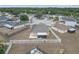 Aerial view of the backyard featuring screen enclosed patio and fenced yard at 4617 Horseshoe Pick Ln, Valrico, FL 33594