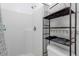 Clean bathroom features a tile shower, white tiled walls, and simple fixtures at 4617 Horseshoe Pick Ln, Valrico, FL 33594