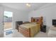 Bright bedroom featuring tile flooring, a ceiling fan, and access to the backyard at 4617 Horseshoe Pick Ln, Valrico, FL 33594