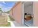 Backyard exterior view of house including door leading into living space and backyard at 4617 Horseshoe Pick Ln, Valrico, FL 33594