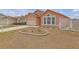 Well-maintained yard and manicured landscape enhancing the curb appeal of the property, with a glimpse of the house at 4617 Horseshoe Pick Ln, Valrico, FL 33594