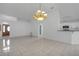 The open-concept living room features tile flooring, high ceilings, and seamless transitions to the kitchen area at 4617 Horseshoe Pick Ln, Valrico, FL 33594
