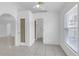 Sunlit living room features tile floors, modern windows, and pantry for ample storage at 4617 Horseshoe Pick Ln, Valrico, FL 33594