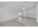 Bright living room with tile floors, decorative tile area, and sliding glass door at 4617 Horseshoe Pick Ln, Valrico, FL 33594