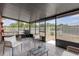 Screened patio with outdoor furniture, grill, and a view of the fenced backyard at 4617 Horseshoe Pick Ln, Valrico, FL 33594
