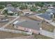 Aerial view of house showing fenced yard, patio area and ample green space at 4617 Horseshoe Pick Ln, Valrico, FL 33594