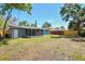 Full view of the privacy fence from the grassy backyard of the home at 4940 Rosedale Ln, Holiday, FL 34690
