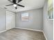 Bedroom featuring new floors, ceiling fan, and closet at 4940 Rosedale Ln, Holiday, FL 34690
