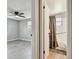 View of a bedroom with ceiling fan and an adjacent bathroom with shower and tub combination at 4940 Rosedale Ln, Holiday, FL 34690