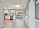 Open kitchen area with stainless steel appliances and sliding glass doors to the backyard at 4940 Rosedale Ln, Holiday, FL 34690