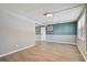 Bright living room with sleek flooring and a fresh coat of modern gray paint at 4940 Rosedale Ln, Holiday, FL 34690