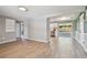 Open living space with stainless steel appliances and view of the backyard through sliding doors at 4940 Rosedale Ln, Holiday, FL 34690