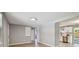 Bright living room with sleek flooring, fresh paint, and ample natural light at 4940 Rosedale Ln, Holiday, FL 34690