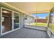 View of the home's interior from screened in back porch with access to fenced backyard at 4940 Rosedale Ln, Holiday, FL 34690