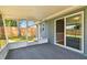 Relaxing screened porch leading to a sliding door and the backyard's privacy fence at 4940 Rosedale Ln, Holiday, FL 34690