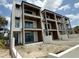 Modern three-story condo featuring covered balconies, sleek design, and a contemporary aesthetic at 501 W Ross Ave # 2, Tampa, FL 33602