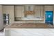 Spacious kitchen features stainless steel appliances, custom cabinets, and large marble island at 501 W Ross Ave # 2, Tampa, FL 33602
