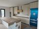 Spacious kitchen with stainless steel appliances, a large island, and custom cabinets at 501 W Ross Ave # 2, Tampa, FL 33602