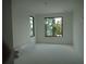 Bright living room with large black frame windows offering view of the outdoors at 501 W Ross Ave # 2, Tampa, FL 33602